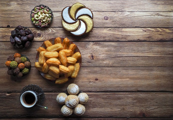 Ramadan sweets on a wooden table. Top view.