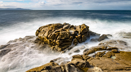 waves crashing on rocks