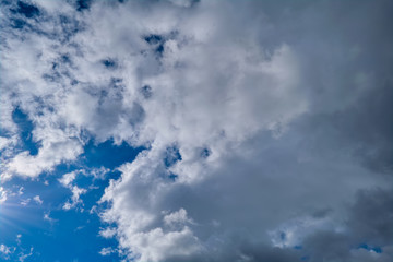 Blue summer sky with white cumulus clouds. Blue summer sky white cumulus clouds background.