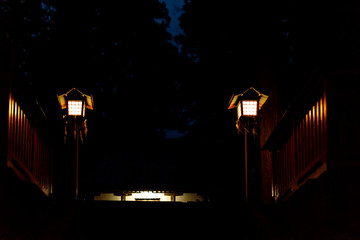 Higashiyama Hakusan Shrine in Takayama, Gifu Prefecture in Japan with entrance to temple building in dark night creepy spooky