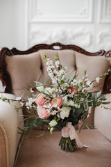 delicate bouquet with spring flowers and pink ranunculus