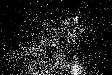 Silhouette of food flakes such as salt or almond or wheat flour spread on the flat surface or table. Abstract grainy texture isolated on black background. Top view of dust, sand blow or bread crumbs.