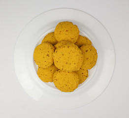 Isolated cookies with goji berries on white background. Vegetarian healthy dessert. Food concept