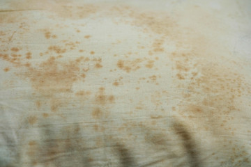 Close up Stains on dirty pillow are a source of germs and dust mites and mattresses, Selective Focus