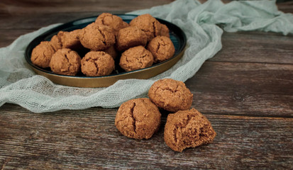 Homemade cinnamon cookies on wooden background