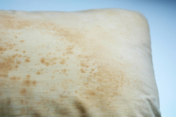 Close up Stains on dirty pillow are a source of germs and dust mites and mattresses, Selective Focus