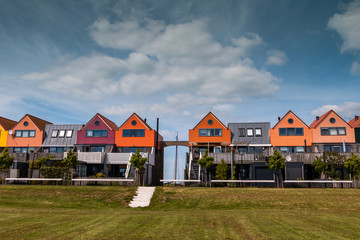 Fototapeta na wymiar Beautiful colored houses in Stavoren at the IJssellake, region Gaasterland, province Friesland