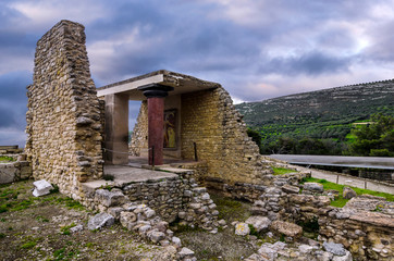 Knossos Palace, Crete / Greece. South Entrance, Corridor With The Prince Of The Lilies fresco at the archaeological site of Knossos in Heraklion. Sunset, cloudy sky