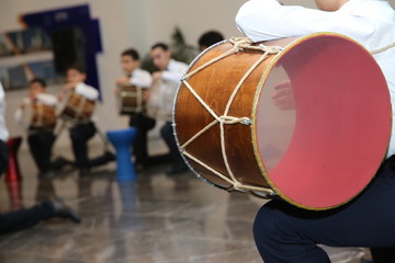 The national instrument of Azerbaijan nagara . children in national costumes play drums . Young...