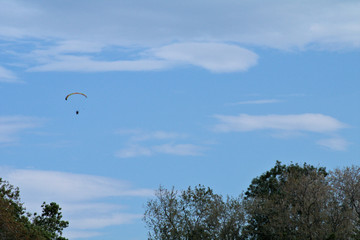 flying in the sky,motorized paraglider,blue, flying, paragliding, parachute, clouds, fly,air, paraglider, freedom,wind, beautiful 