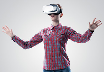 Girl in mask experiencing virtual reality as new entertainment device