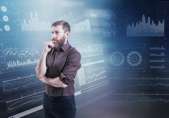 A businessman thinking standing against an abstract financial charts on the background