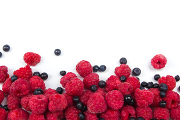 Various fresh summer berries on a white background. Top view
