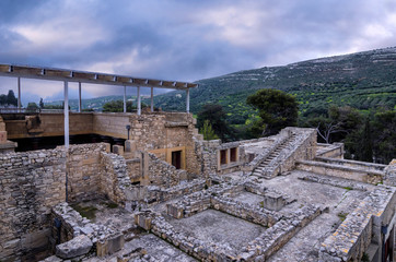 Knossos Palace, Crete / Greece. View of the archaeological site of Knossos in Heraklion at sunset. Cloudy sky