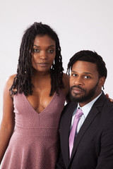 Black couple together looking thoughtful