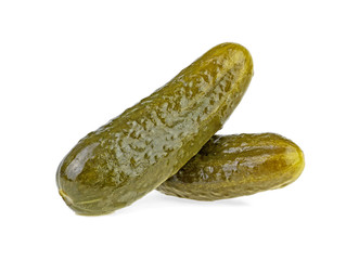 Two marinated pickled cucumbers isolated on white background