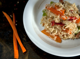 Rice with vegetables on a white plate