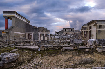 Fototapeta na wymiar Knossos, Crete - Greece. Knossos Palace at the archaeological site of Knossos which is the largest Bronze Age archaeological site on Crete and has been called Europe's oldest city. Sunset, cloudy sky