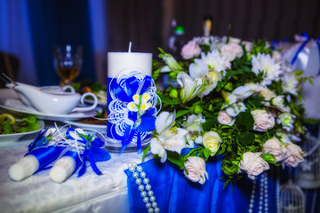 Beautiful candles and flowers on the wedding table