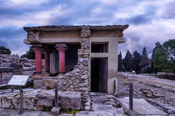 Fototapeta na wymiar Knossos, Crete - Greece. The North Lustral Basin room at the archaeological site of knossos resembles a cistern. Its floor is lower than the surrounded area and is reached by steps. Sunset, cloudy sky