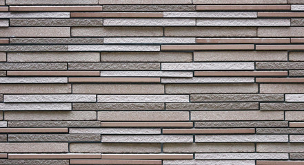 Modern slim design brick block masonry fence wall texture background.