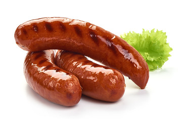 German grilled pork sausages with lettuce, close-up, isolated on white background