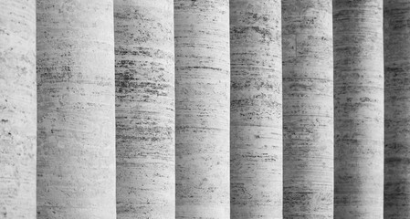 Row of white travertine columns. Colonnade of St Peters Square in Vatican City