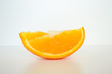 slice of orange isolated on white background