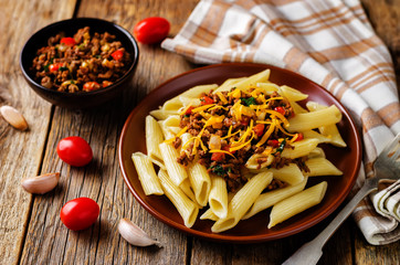 Minced beef pepper pasta with glass of wine