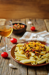 Minced beef pepper pasta with glass of wine