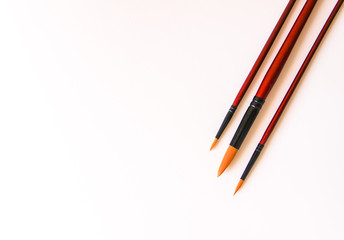 Paint brushes on white background for acrylic, gouache, watercolor painting.