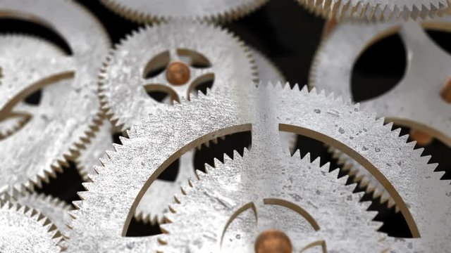 camera moves along the rotating gears and focuses on the inscription ERP on the gear