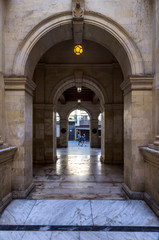 Heraklion, Crete Island / Greece. Venetian Loggia, interior view. Looking through the arches from the courtyard to the 25th August street. Loggia houses the town hall of Heraklion