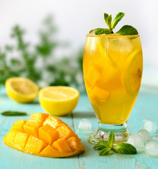 Yellow iced tea with pineapple, lemon