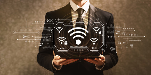 Wifi with businessman holding a tablet computer