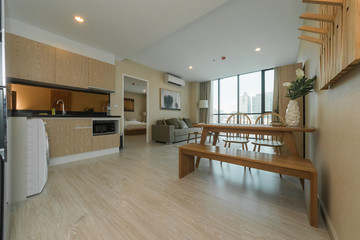 Modern bright kitchen with a dinner table. Interior design.