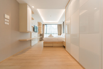 Modern interior design in small apartment with bedroom.