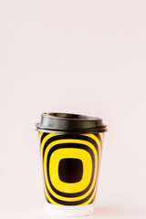 Take-out coffee in thermo cup on a pink background, Copy space