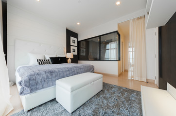 Warm bedroom interior with a comfy bed