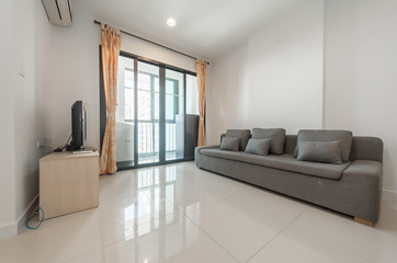 Modern living room and kitchen in small apartment