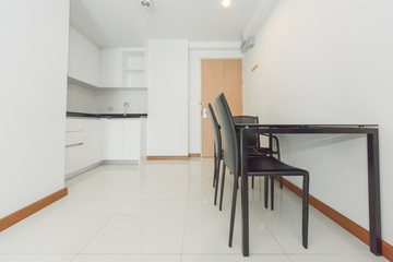 Stylish kitchen interior with dining table and chairs