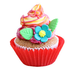 Colorful cupcake with sugar flowers in a red cup isolated on white background