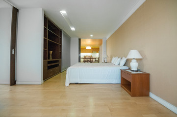 Fototapeta na wymiar Interior of a spacious bedroom in loft apartment 
