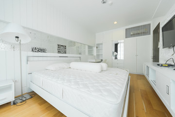 Warm bedroom interior with a comfy bed,