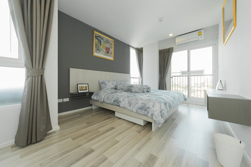 Warm bedroom interior with a comfy bed,