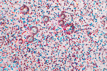 Transparent slime with glittering multicolor particles