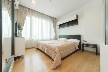 Warm bedroom interior with a comfy bed,