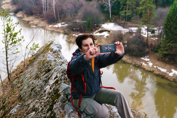 selfie on top of a cliff above the spring river