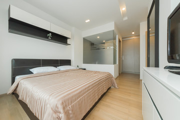 Warm bedroom interior with a comfy bed,