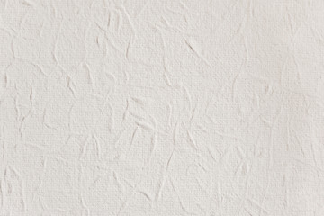 abstract background of white embossed paper close up